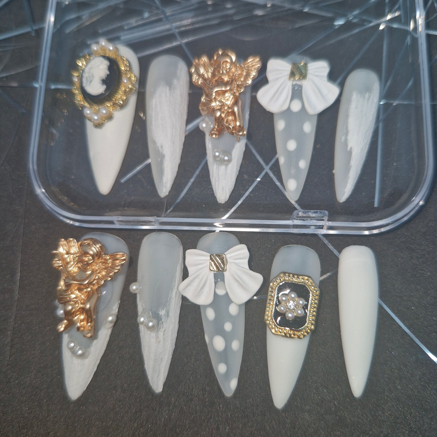 Angelic Elegance: Press-On Nails with Cherubic Embellishments and Pearlescent Accents